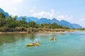 Vang Vieng, Laos - February 17, 2017: Tourists kayaking at Nam S