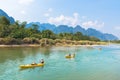 Vang Vieng, Laos - February 17, 2017: Tourists kayaking at Nam