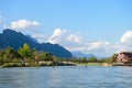 Vang Vieng, Laos - November 13, 2014 : Toursit activies with wooden bridge over Song river in Vangvieng, Vang Vieng is a tourist Royalty Free Stock Photo