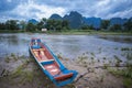 Vang Vieng Vientiane Laos wooden boat river Royalty Free Stock Photo