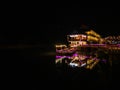 Beautiful view of nam song river with riverside restaurant and the mountain in the night at Vangvieng city Lao. Royalty Free Stock Photo