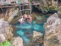 Unacquainted Local child playing or swimming in Clear water pool at Tham Chang cave Vangvieng City Laos
