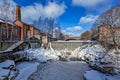 Waterfall in Vanhankaupunginkoski and old power station, Helsinki Royalty Free Stock Photo