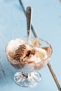 Vanilla and chocolate ice cream in the crystal bowl on the wooden planks Royalty Free Stock Photo