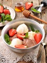 Vanilla and chocolate ice cream with organic strawberries. Rustic style. Royalty Free Stock Photo