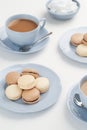 Vanilla and Chocolate Macarons with Tea Royalty Free Stock Photo