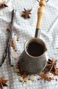 Vanilla coffee in the traditional cezve with a vanilla pod.