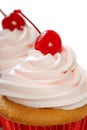 Vanilla cupcake with maraschino cherry