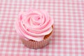 Vanilla cupcake with pink rose icing Royalty Free Stock Photo