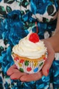 Vanilla cupcake with white frosting and cherry on top Royalty Free Stock Photo