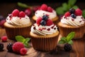 Vanilla cupcakes with cream and berries Royalty Free Stock Photo