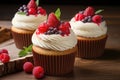 Vanilla cupcakes with cream and berries Royalty Free Stock Photo