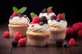 Vanilla cupcakes with cream and berries Royalty Free Stock Photo