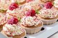 Vanilla cupcakes decorated fresh strawberries in delivery box Royalty Free Stock Photo