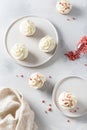 Vanilla cupcakes decorated with white frosting and dried strawberry on gray table. Top view. Cookbook recipe, menu, bakery, pastry Royalty Free Stock Photo