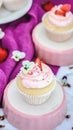 Vanilla cupcakes with strawberry icing closeup