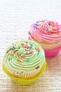 Vanilla cupcakes with strawberry and lime icing Royalty Free Stock Photo