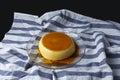 Vanilla flan served in glass dish on a kitchen cloth Royalty Free Stock Photo