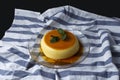 Vanilla flan served in glass dish on a kitchen cloth Royalty Free Stock Photo