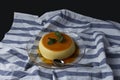 Vanilla flan served in glass dish on a kitchen cloth Royalty Free Stock Photo
