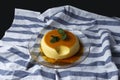 Vanilla flan served in glass dish on a kitchen cloth Royalty Free Stock Photo