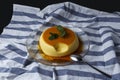 Vanilla flan served in glass dish on a kitchen cloth Royalty Free Stock Photo