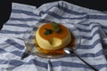 Vanilla flan served in glass dish on a kitchen cloth Royalty Free Stock Photo