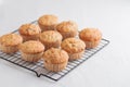 Vanilla fresh baked muffins on a white table with nuts and berries Royalty Free Stock Photo