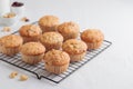 Vanilla fresh baked muffins on a white table with nuts and berries Royalty Free Stock Photo