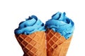 Vanilla frozen yogurt or colorful soft ice cream in waffle cone