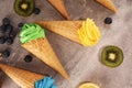 Vanilla frozen yogurt or colorful soft ice cream in waffle cone Royalty Free Stock Photo