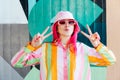 Vanilla Girl. Kawaii vibes. Candy colors design. Young woman with pink hair and sunglasses in Bucket hat and multicolor