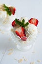 Vanilla ice cream with almonds and strawberries Royalty Free Stock Photo