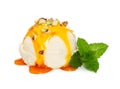 Vanilla ice cream ball with caramel syrup, nuts and fresh mint Royalty Free Stock Photo