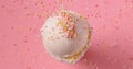 vanilla ice cream ball with falling sugar sprinkles Royalty Free Stock Photo