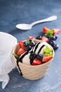 Vanilla ice cream with berries and chocolate syrup Royalty Free Stock Photo