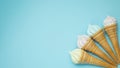 Vanilla ice cream cone on blue faded pastel color background. Vanilla ice cream in wafer cup Royalty Free Stock Photo