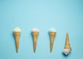 Vanilla ice cream cone on blue faded pastel color background. Vanilla ice cream in wafer cup Royalty Free Stock Photo