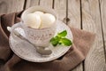 Vanilla ice cream in cup on rustic wooden background Royalty Free Stock Photo