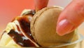 Vanilla ice cream macro closeup with chocolate sauce and macron cookies. Royalty Free Stock Photo