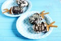Vanilla Ice cream popsicles coated with chocolate and nuts