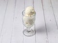 Vanilla ice cream scoop served in cup isolated on table top view of dessert Royalty Free Stock Photo