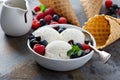 Vanilla ice cream scoops in a bowl with fresh berries Royalty Free Stock Photo