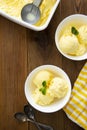 Vanilla ice cream scoops sundae in bowl on wooden background, copy space Royalty Free Stock Photo