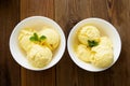 Vanilla ice cream scoops sundae in bowl on wooden background Royalty Free Stock Photo