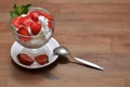 Vanilla ice cream with sliced strawberries and mint in a glass bowl Royalty Free Stock Photo