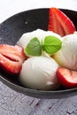 Vanilla ice cream with strawberries and almonds served in a plate Royalty Free Stock Photo