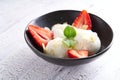 Vanilla ice cream with strawberries and almonds served in a plate Royalty Free Stock Photo