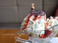 Fresh strawberries and vanilla ice cream with whipped cream on a glass bowl. Royalty Free Stock Photo