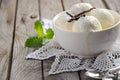 Vanilla ice cream in white bowl on rustic wooden background Royalty Free Stock Photo